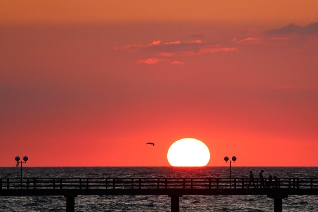 sunset, sea, heaven, water, ocean, dusk, clouds, nature, eve, peaceful, coast, quiet, reflection, mood, evening atmosphere, baltic sea, sun, red, vacation, vacations, pier, kühlungsborn, mecklenburg western pomerania, relax, people